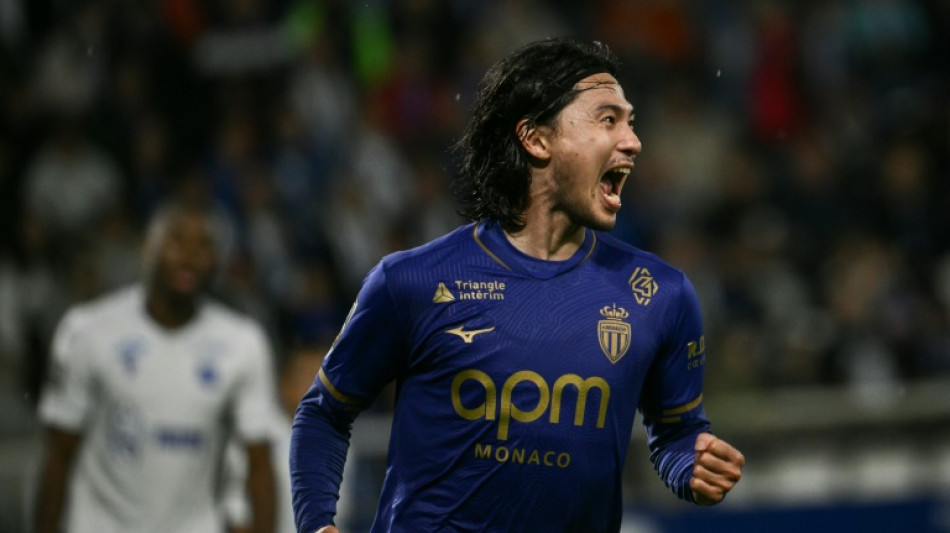 Monaco squeeze past 10-man Auxerre to climb to third