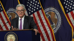 US Fed pauses rate hikes but predicts long fight against inflation