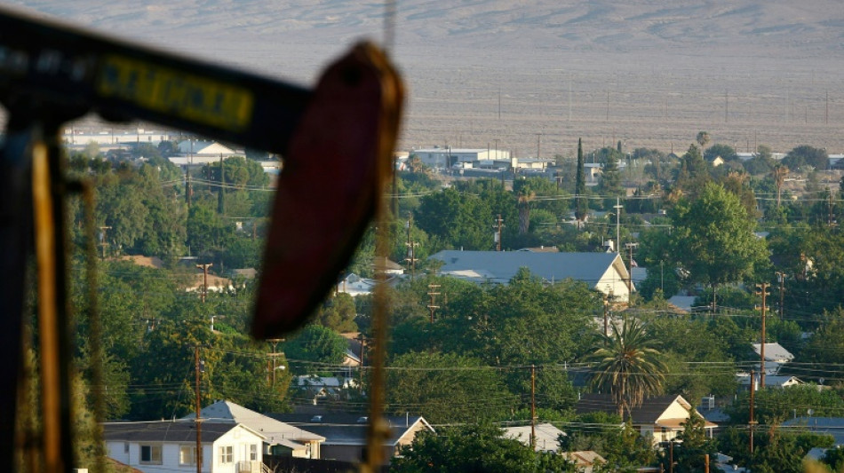 Asian markets drop ahead of Fed decision, oil prices push higher