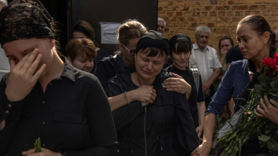 Tears, anger as Ukrainians mourn victims of Russian theatre strike