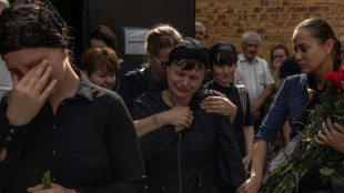 Tears, anger as Ukrainians mourn victims of Russian theatre strike
