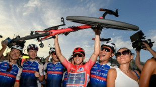 Belgian Evenepoel wins 'historic' Grand Tour at Vuelta a Espana