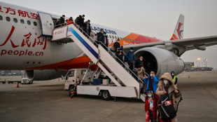 China levanta cuarentenas a viajeros internacionales y pone fin a tres a&ntilde;os de aislamiento