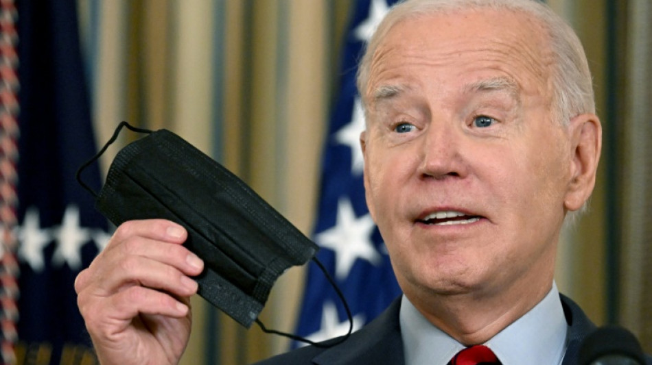 Maskless Biden laughs off Covid guidance