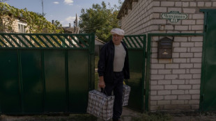 Ukrainians flee 'ghost town' as Russians seek recapture