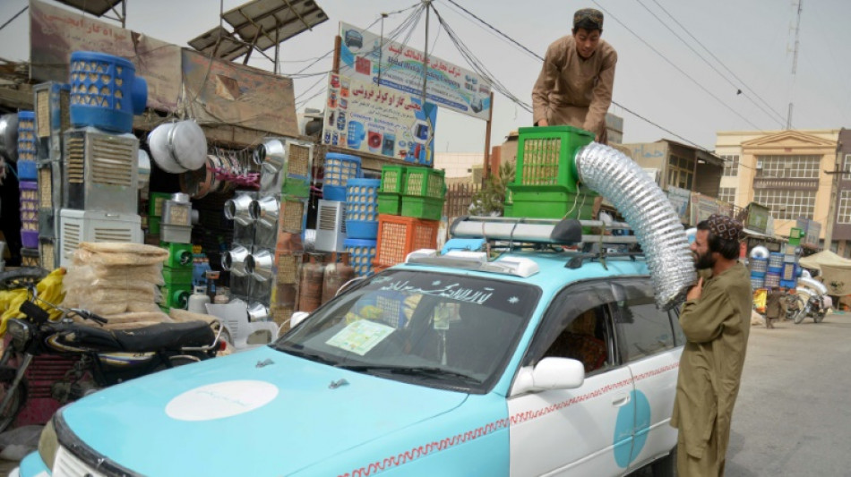 Fatigued Afghan taxi drivers take novel approach to AC