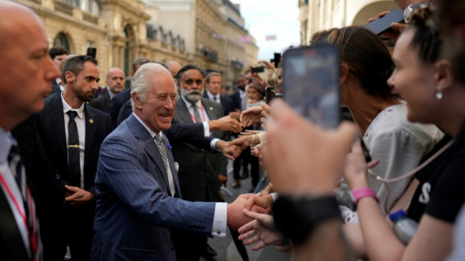 'Big shoes to fill': Paris crowd greets Charles III