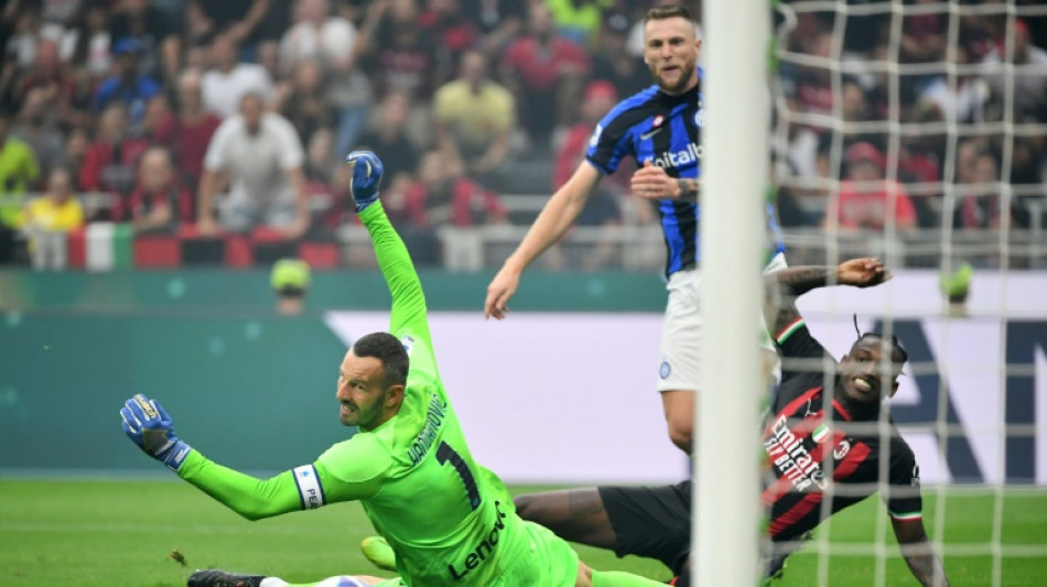 Leao claims derby honours for leaders Milan, Napoli retake top spot