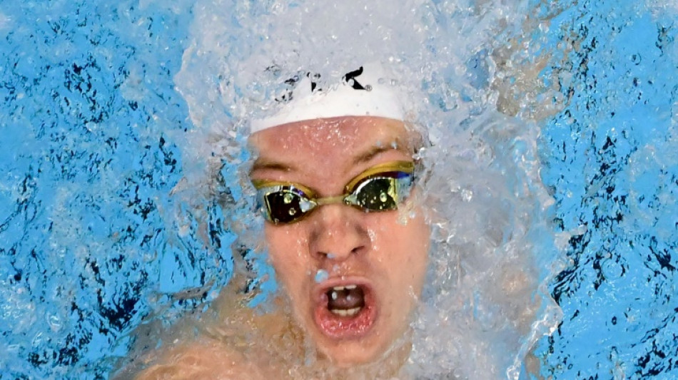 France's Marchand wins 200 IM world title for third gold