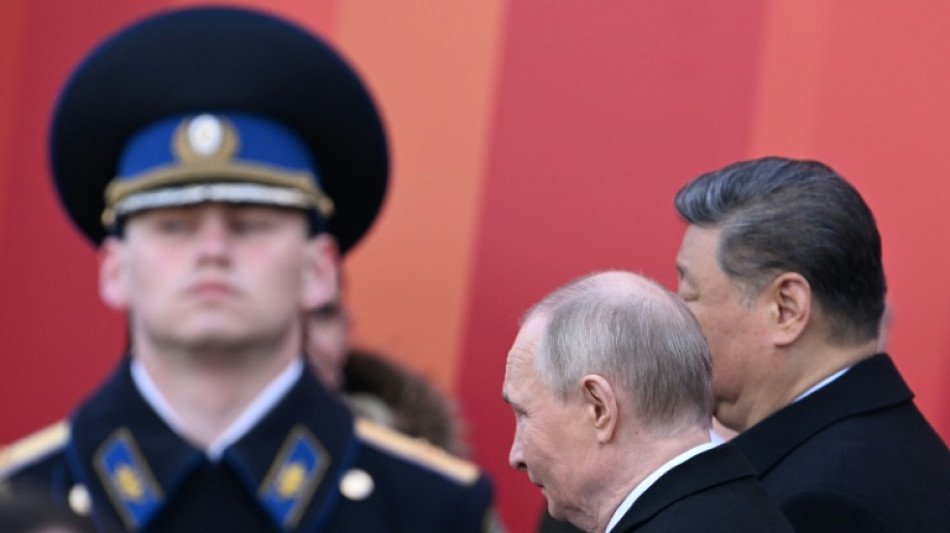 Putin hails troops in Ukraine as allies attend WWII parade