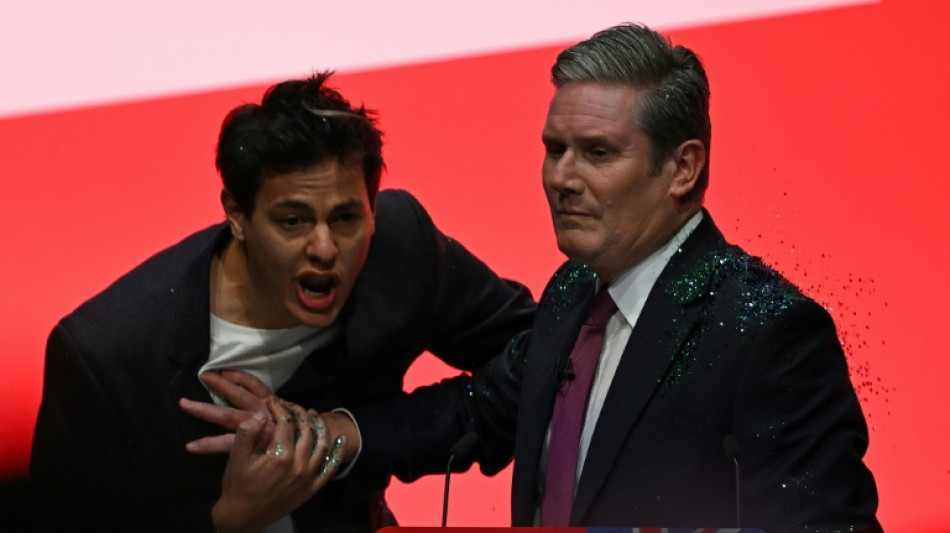 Heckler showers glitter on UK opposition leader before key speech