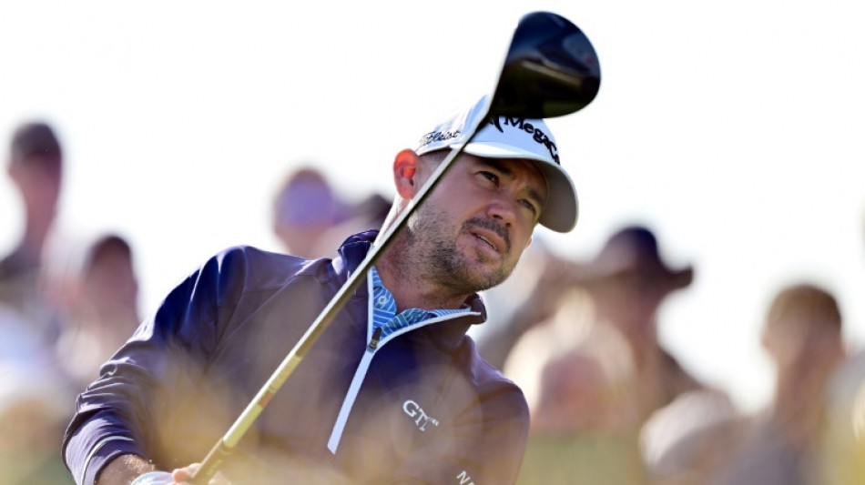 Harman eagles 18th as he soars into lead at British Open