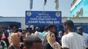 Desperate Sudanese face endless wait for passports so they can flee