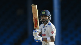 Kohli hits landmark ton but West Indies fight back