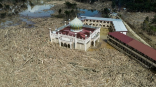 Nowhere to pray as logs choke flood-hit Indonesian mosque 