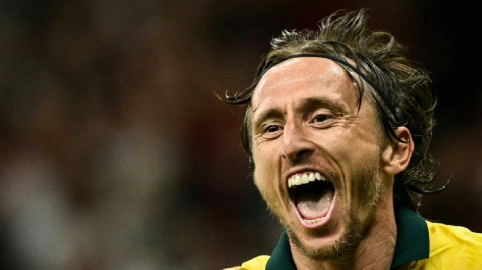 Timeless Modric opens AC Milan account with winner against Bologna