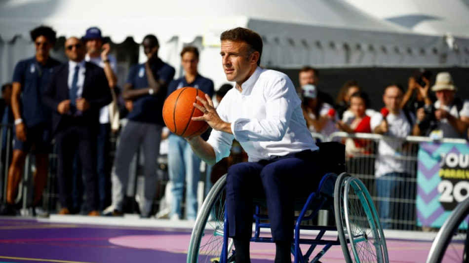 Macron takes to wheelchair to urge French to support 2024 Paralympics