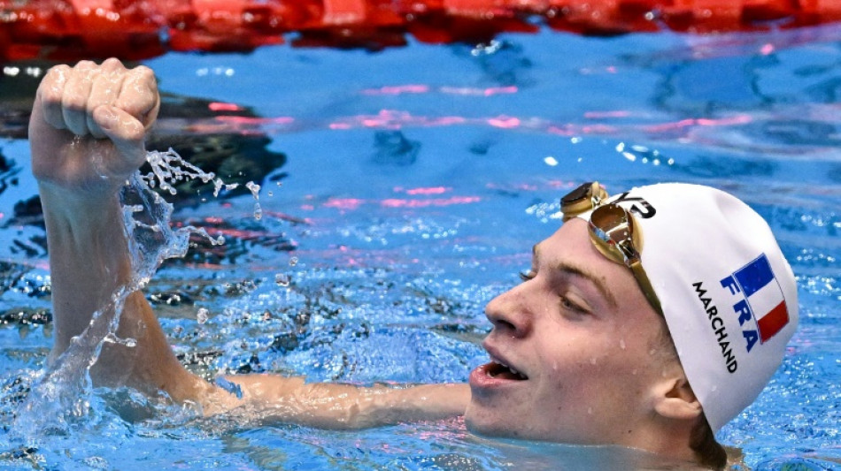 Marchand wins third gold while Australia scoop more titles