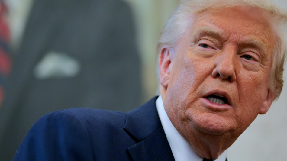 Trump says won't fire Fed chief, signals China tariffs will come down